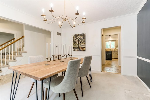 dining space featuring a chandelier, ornamental molding, and stairway