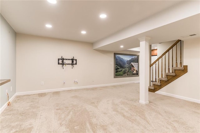 finished below grade area featuring carpet floors, recessed lighting, baseboards, and stairway