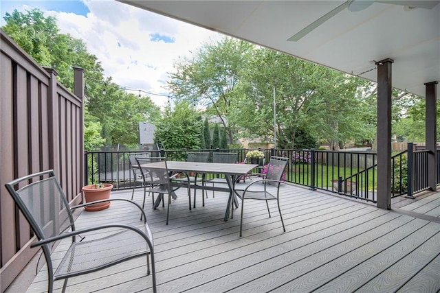 wooden terrace featuring outdoor dining area