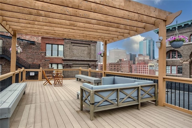 deck with a view of city and an outdoor living space with a fireplace