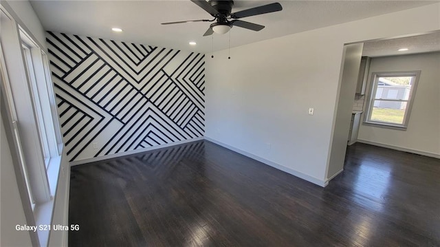 unfurnished room featuring dark wood finished floors, recessed lighting, baseboards, and ceiling fan