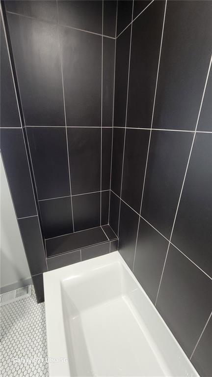 bathroom view of tiled shower