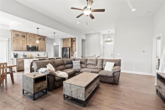 1002 Fox Trot Dr, Odessa, MO 64076 - living room with wood finished floors, recessed lighting, a ceiling fan, and baseboards