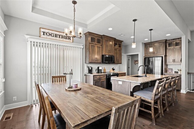 1002 Fox Trot Dr, Odessa, MO 64076 - dining room featuring dark wood-style flooring, a chandelier, baseboards, recessed lighting, and crown molding