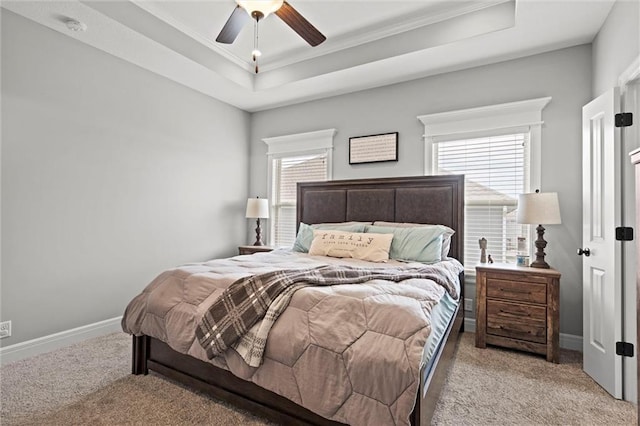 1002 Fox Trot Dr, Odessa, MO 64076 - bedroom with light carpet, ornamental molding, a tray ceiling, and baseboards