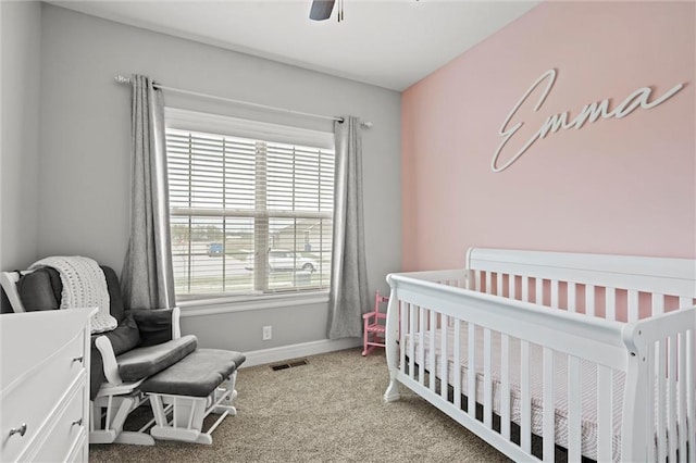 1002 Fox Trot Dr, Odessa, MO 64076 - carpeted bedroom featuring a crib, baseboards, and a ceiling fan