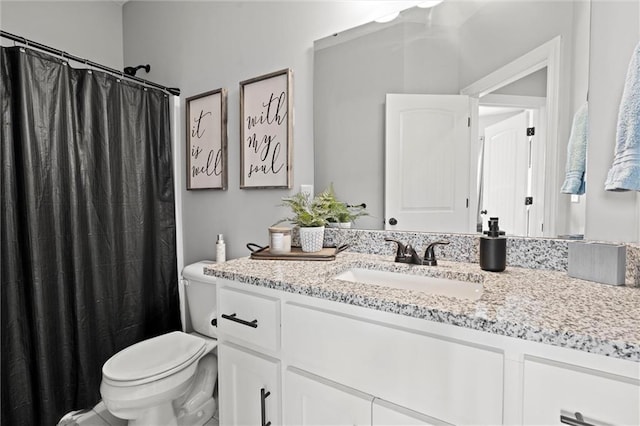 1002 Fox Trot Dr, Odessa, MO 64076 - bathroom featuring toilet, vanity, and a shower with shower curtain