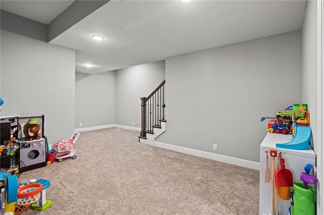 1002 Fox Trot Dr, Odessa, MO 64076 - playroom with carpet, a textured ceiling, baseboards, and recessed lighting