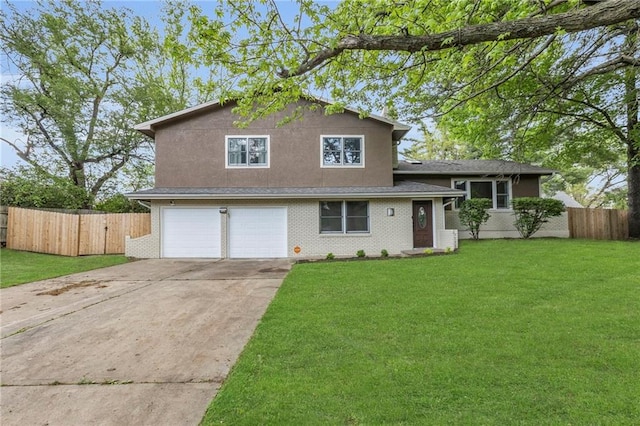 split level home featuring fence, an attached garage, driveway, and a front lawn