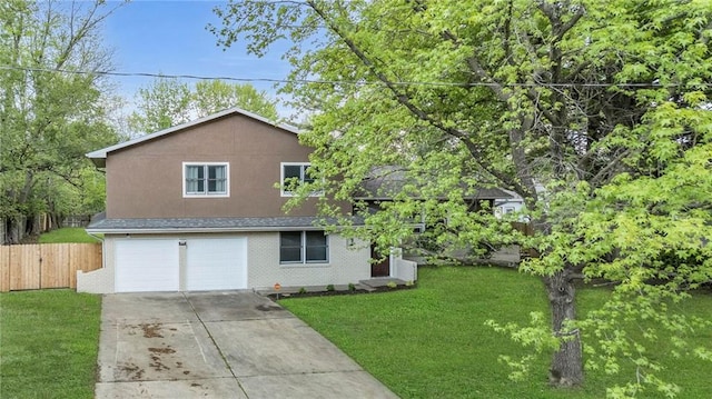 split level home featuring fence, an attached garage, a front lawn, brick siding, and driveway