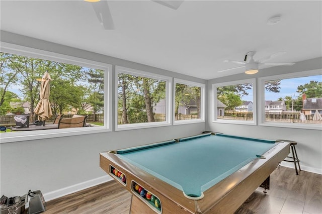 rec room with baseboards, ceiling fan, and wood finished floors