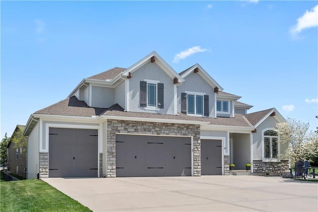 view of front of property featuring stucco siding, driveway, stone siding, and a garage