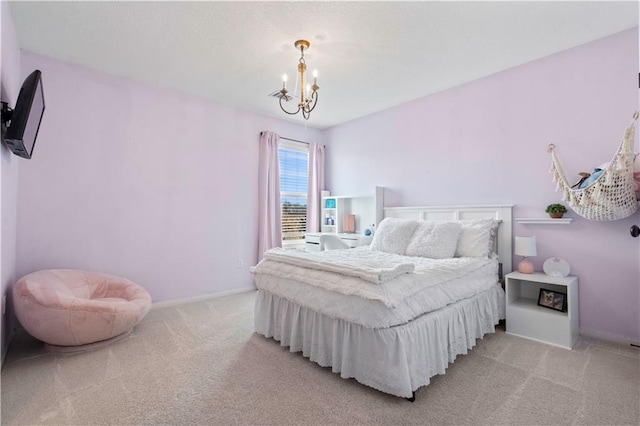 bedroom featuring light colored carpet, a chandelier, and baseboards