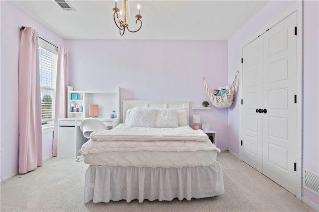 bedroom with light carpet and baseboards