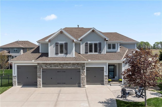view of front of house featuring concrete driveway, fence, stucco siding, a garage, and a shingled roof