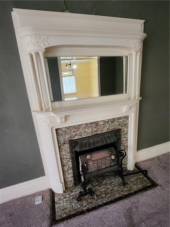 room details with carpet flooring and a premium fireplace
