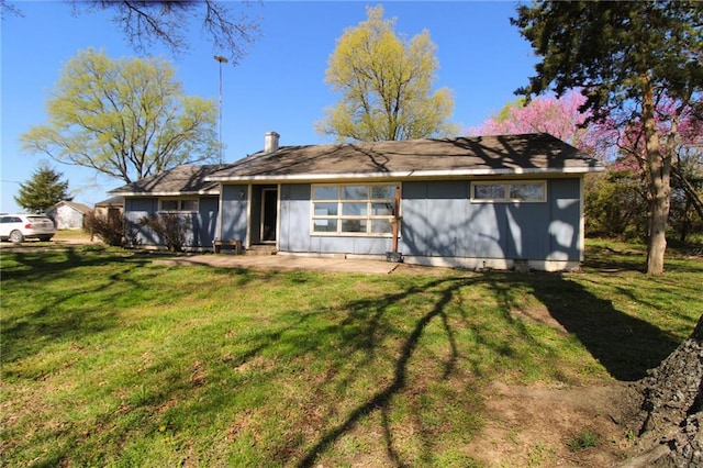 25388 Chieftain Rd, Lawrence, KS 66044 - rear view of property with a lawn