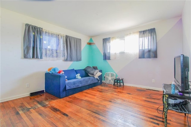 25388 Chieftain Rd, Lawrence, KS 66044 - living area featuring hardwood / wood-style floors and baseboards