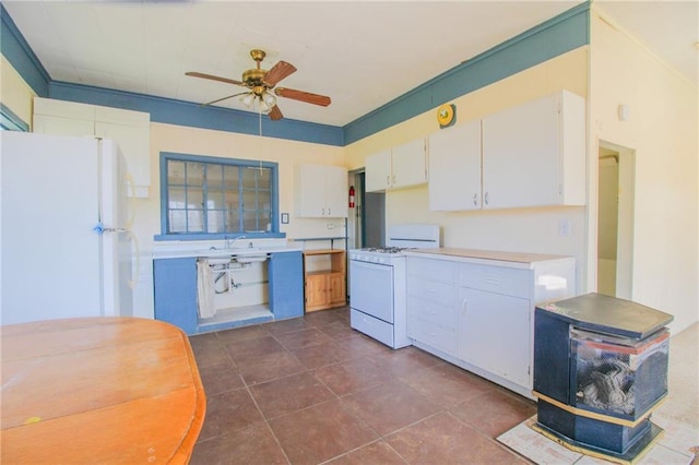 25388 Chieftain Rd, Lawrence, KS 66044 - kitchen with white appliances, a ceiling fan, white cabinetry, a sink, and light countertops