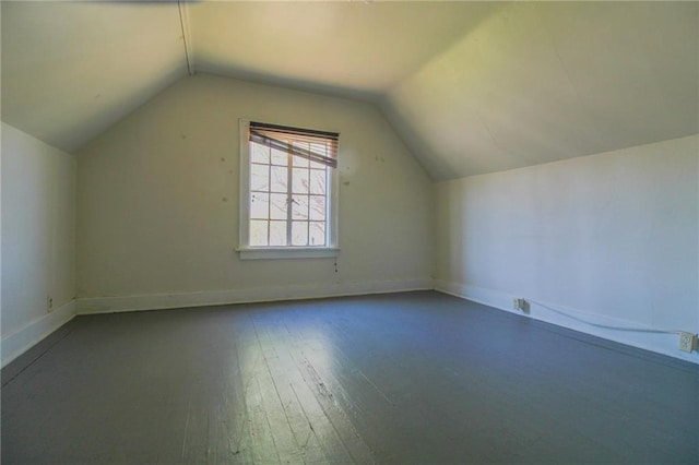 25388 Chieftain Rd, Lawrence, KS 66044 - bonus room with wood-type flooring, baseboards, and vaulted ceiling