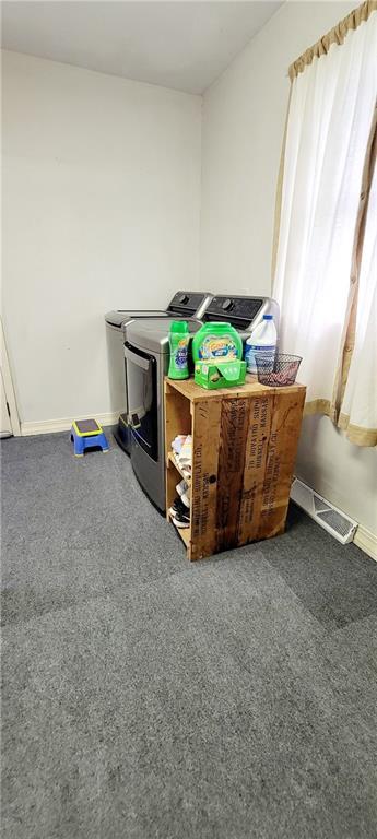 1463 Missouri Rd, Iola, KS 66749 - washroom featuring independent washer and dryer, baseboards, and carpet