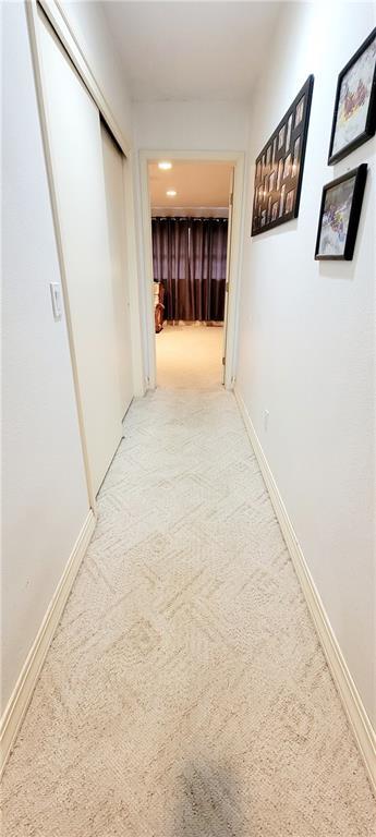1463 Missouri Rd, Iola, KS 66749 - hallway featuring carpet floors and baseboards