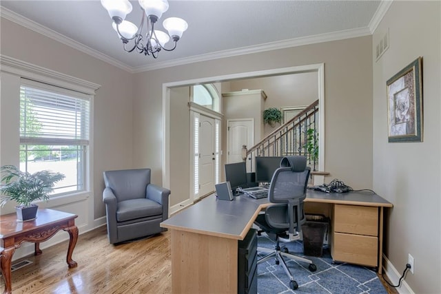4102 NW 76th Ter, Kansas City, MO 64151 - office area with healthy amount of natural light, a chandelier, crown molding, and wood finished floors
