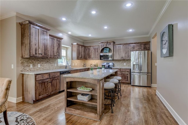 4102 NW 76th Ter, Kansas City, MO 64151 - kitchen featuring stainless steel appliances, open shelves, a kitchen bar, light wood-type flooring, and decorative backsplash