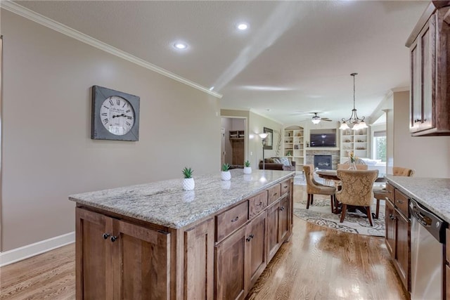 4102 NW 76th Ter, Kansas City, MO 64151 - kitchen with dishwasher, a fireplace, crown molding, light wood-type flooring, and ceiling fan