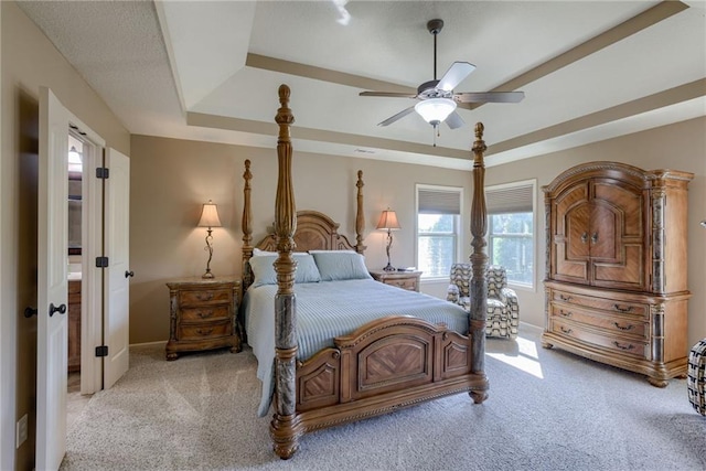 4102 NW 76th Ter, Kansas City, MO 64151 - bedroom featuring a tray ceiling, carpet flooring, baseboards, and ceiling fan