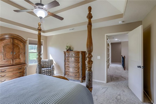 4102 NW 76th Ter, Kansas City, MO 64151 - bedroom with light colored carpet, a raised ceiling, baseboards, and ceiling fan