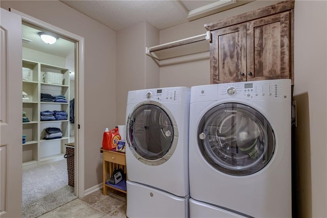 4102 NW 76th Ter, Kansas City, MO 64151 - laundry area with cabinet space, washing machine and dryer, and a textured ceiling