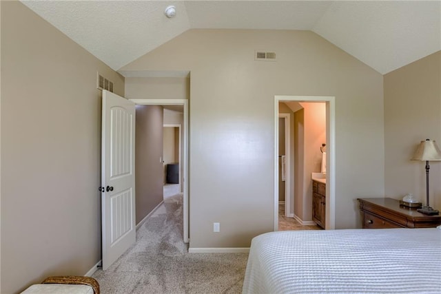 4102 NW 76th Ter, Kansas City, MO 64151 - bedroom with vaulted ceiling, light colored carpet, baseboards, and ensuite bathroom