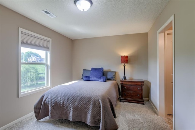 4102 NW 76th Ter, Kansas City, MO 64151 - bedroom with light carpet, baseboards, and a textured ceiling