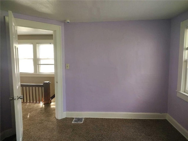 10816 E 27th St, Independence, MO 64052 - unfurnished room featuring baseboards, visible vents, and carpet floors