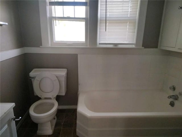 10816 E 27th St, Independence, MO 64052 - bathroom featuring tile patterned flooring, a bath, toilet, and vanity