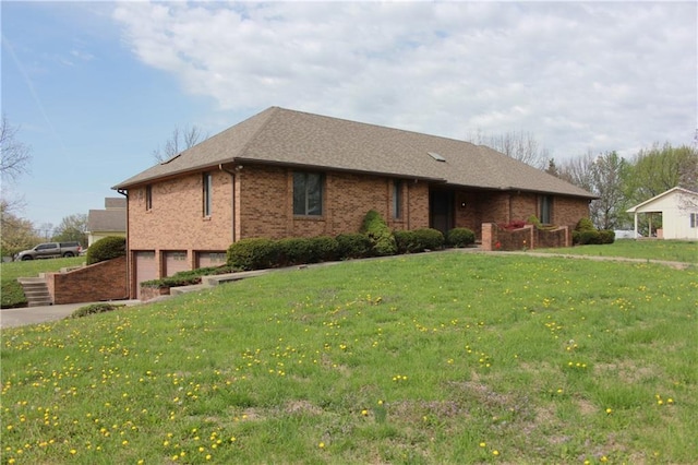 1410 Grandview Dr, Warrensburg, MO 64093 - ranch-style home with a garage, a front yard, brick siding, and concrete driveway