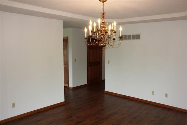 1410 Grandview Dr, Warrensburg, MO 64093 - spare room with a chandelier, baseboards, and dark wood-type flooring