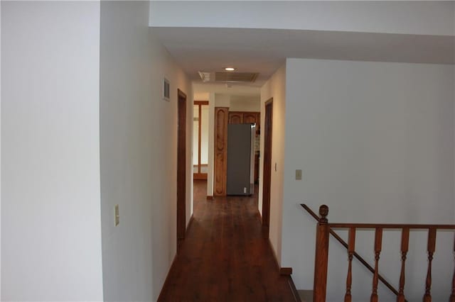 1410 Grandview Dr, Warrensburg, MO 64093 - hall featuring an upstairs landing and dark wood-style flooring