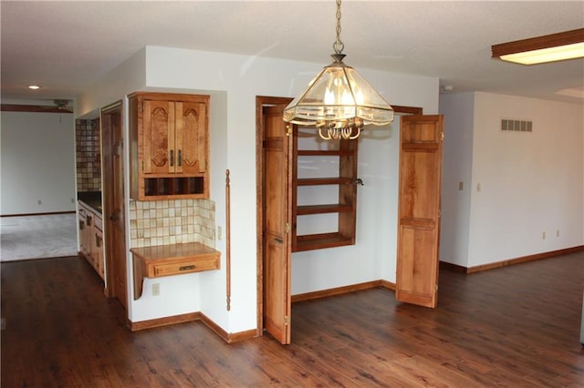 1410 Grandview Dr, Warrensburg, MO 64093 - unfurnished dining area featuring a chandelier, baseboards, dark wood-type flooring, and recessed lighting