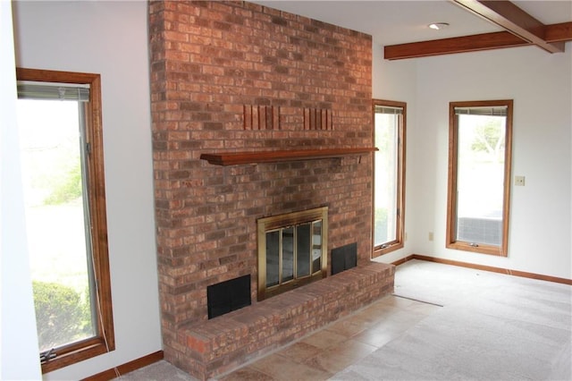 1410 Grandview Dr, Warrensburg, MO 64093 - unfurnished living room with a brick fireplace, baseboards, carpet, beam ceiling, and plenty of natural light