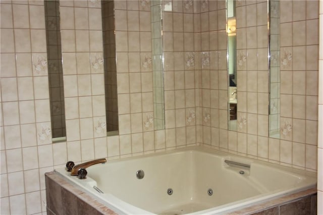 1410 Grandview Dr, Warrensburg, MO 64093 - bathroom featuring a whirlpool tub and tile walls