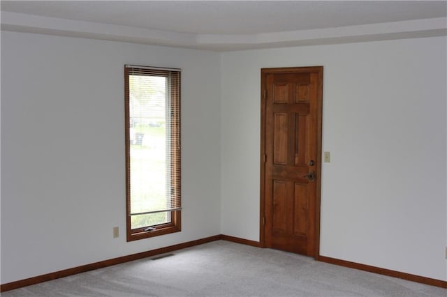 1410 Grandview Dr, Warrensburg, MO 64093 - empty room with light carpet, healthy amount of natural light, and baseboards