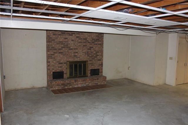 1410 Grandview Dr, Warrensburg, MO 64093 - below grade area featuring a brick fireplace