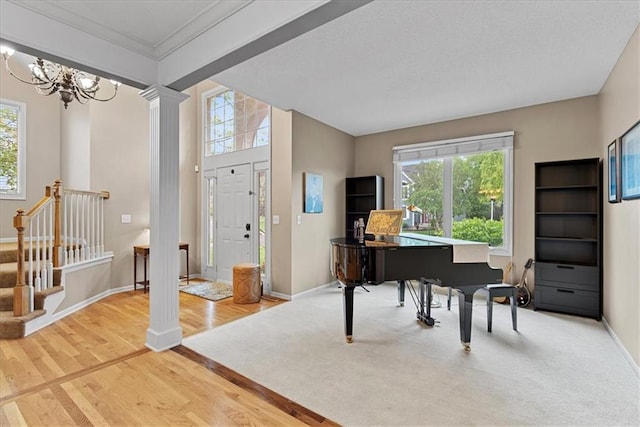 foyer entrance with healthy amount of natural light, wood finished floors, and baseboards