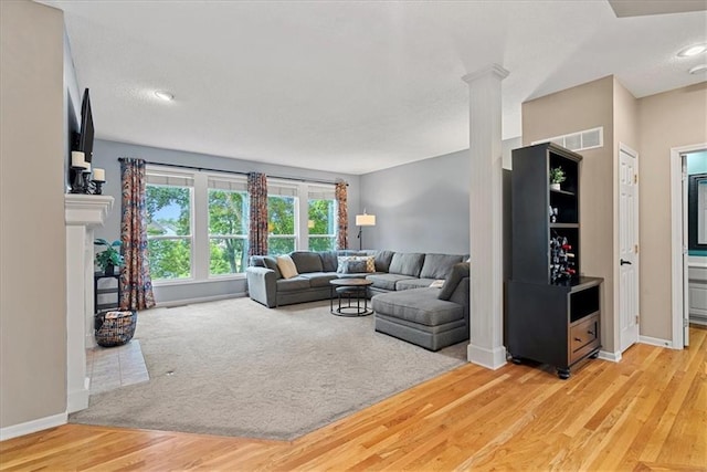 living area with wood finished floors and baseboards