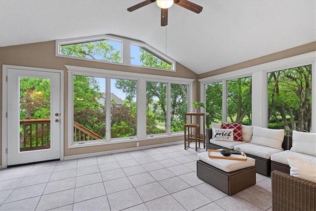 sunroom featuring vaulted ceiling and tile patterned flooring