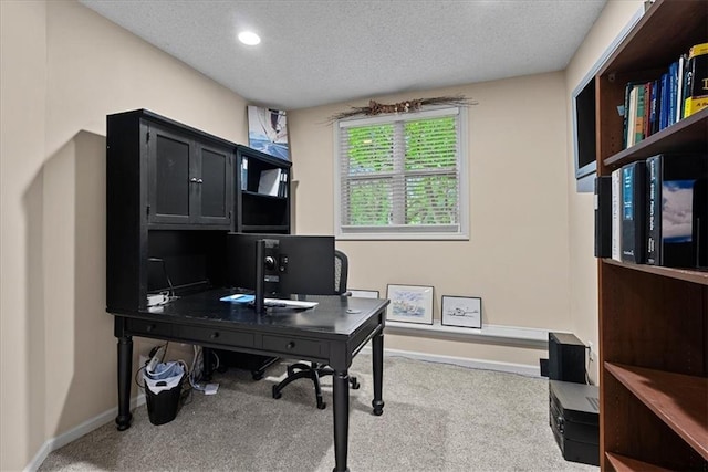 carpeted office space featuring a textured ceiling, baseboards, and recessed lighting