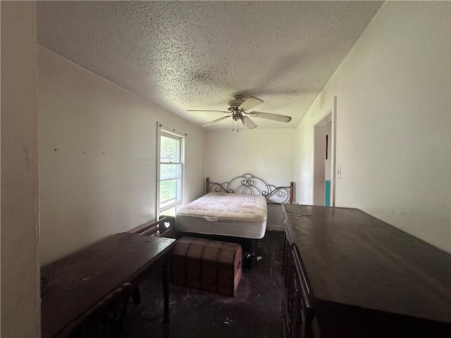 218 S Kent St, Excelsior Springs, MO 64024 - bedroom with a textured ceiling and ceiling fan