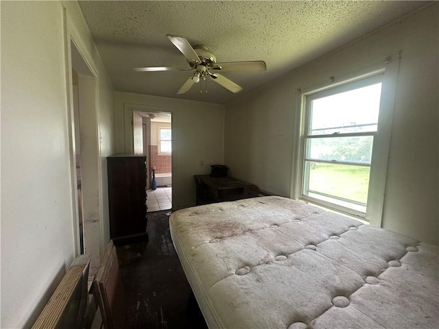 218 S Kent St, Excelsior Springs, MO 64024 - bedroom with a textured ceiling and a ceiling fan